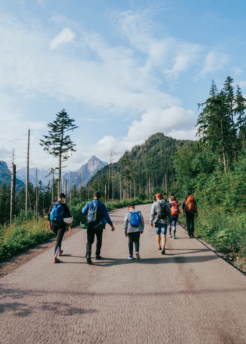 Free A group of hikers enjoys a sunny day trekking through the stunning mountains of Zakopane, Poland. Stock Photo