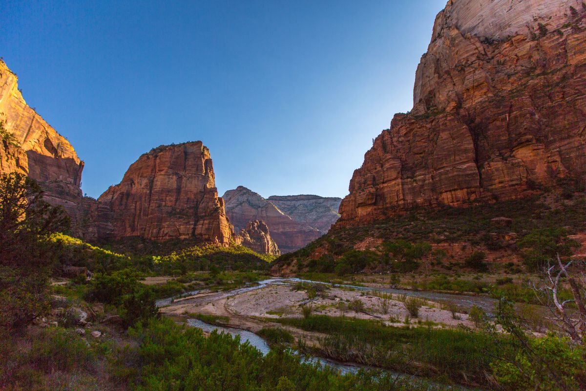 Zion National Park canyon with the Virgin River winding through towering red sandstone walls