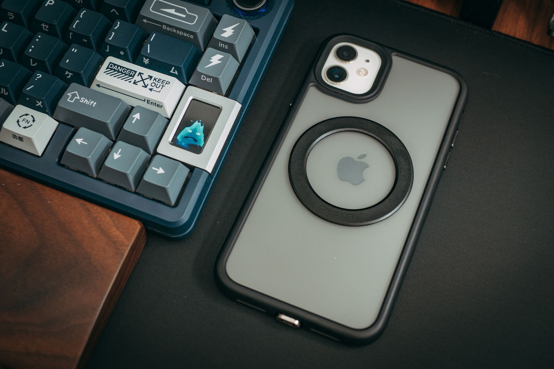 Apple Iphone Lying on Desk near Keyboard