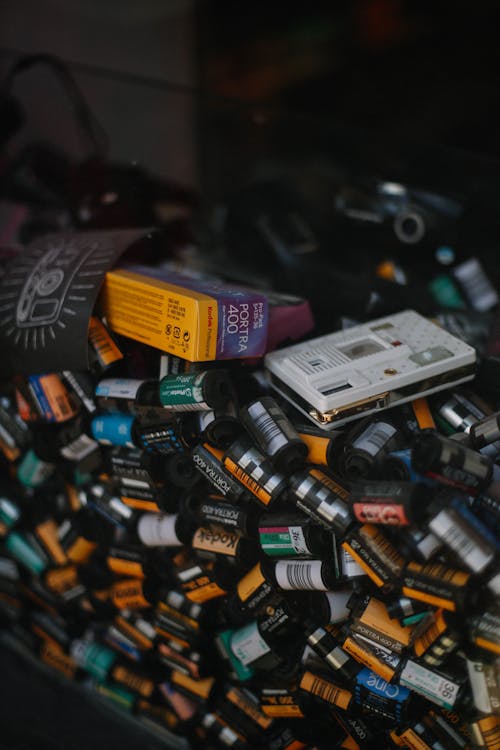 A pile of old cassette tapes and a camera