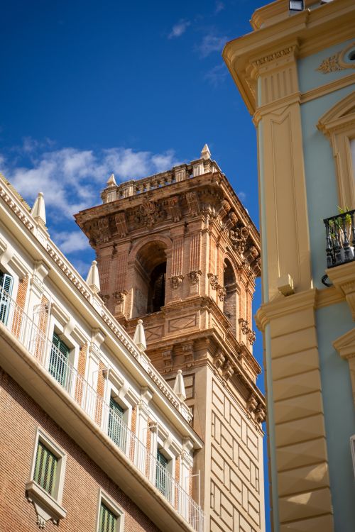 Free Architectural detail of a historic tower in Valencia, Spain under clear blue skies. Stock Photo