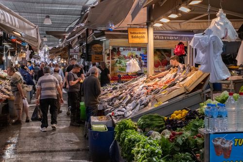 Free A bustling fish market in İzmir with fresh produce and shoppers exploring the stalls. Stock Photo