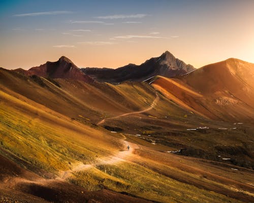 Dirt Road and Mountains during Day