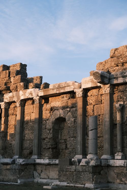 Free Explore the ancient Roman ruins in Antalya, Türkiye under a warm evening light. Stock Photo
