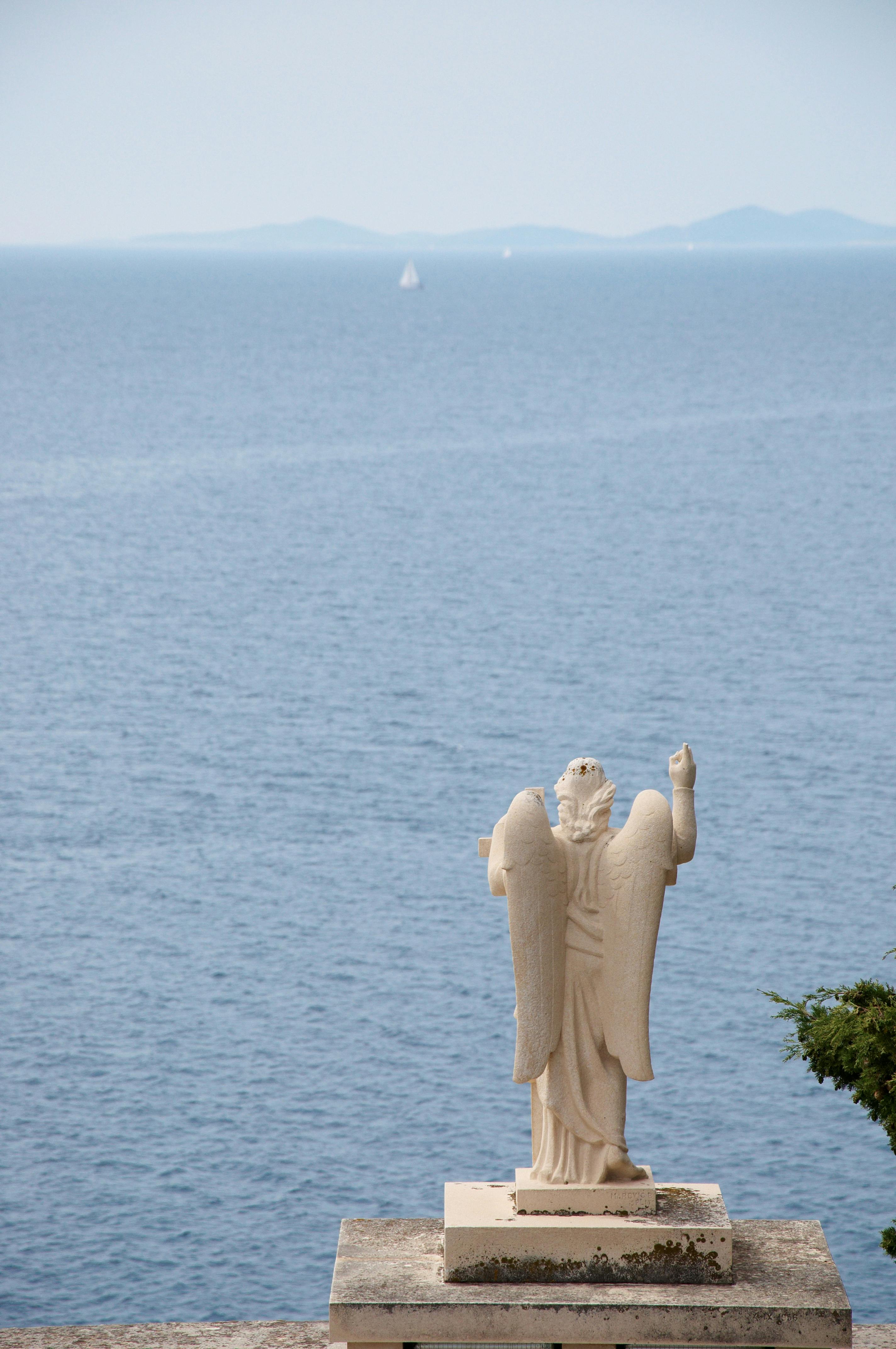Statue by Sea Against Sky