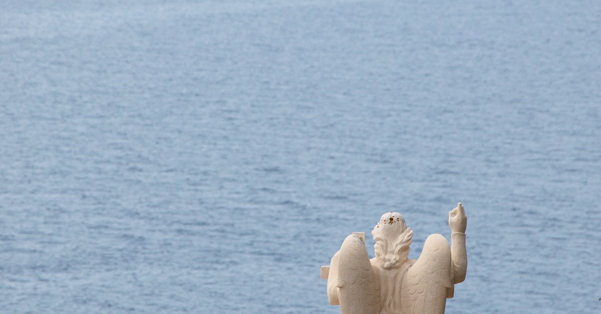 Statue by Sea Against Sky