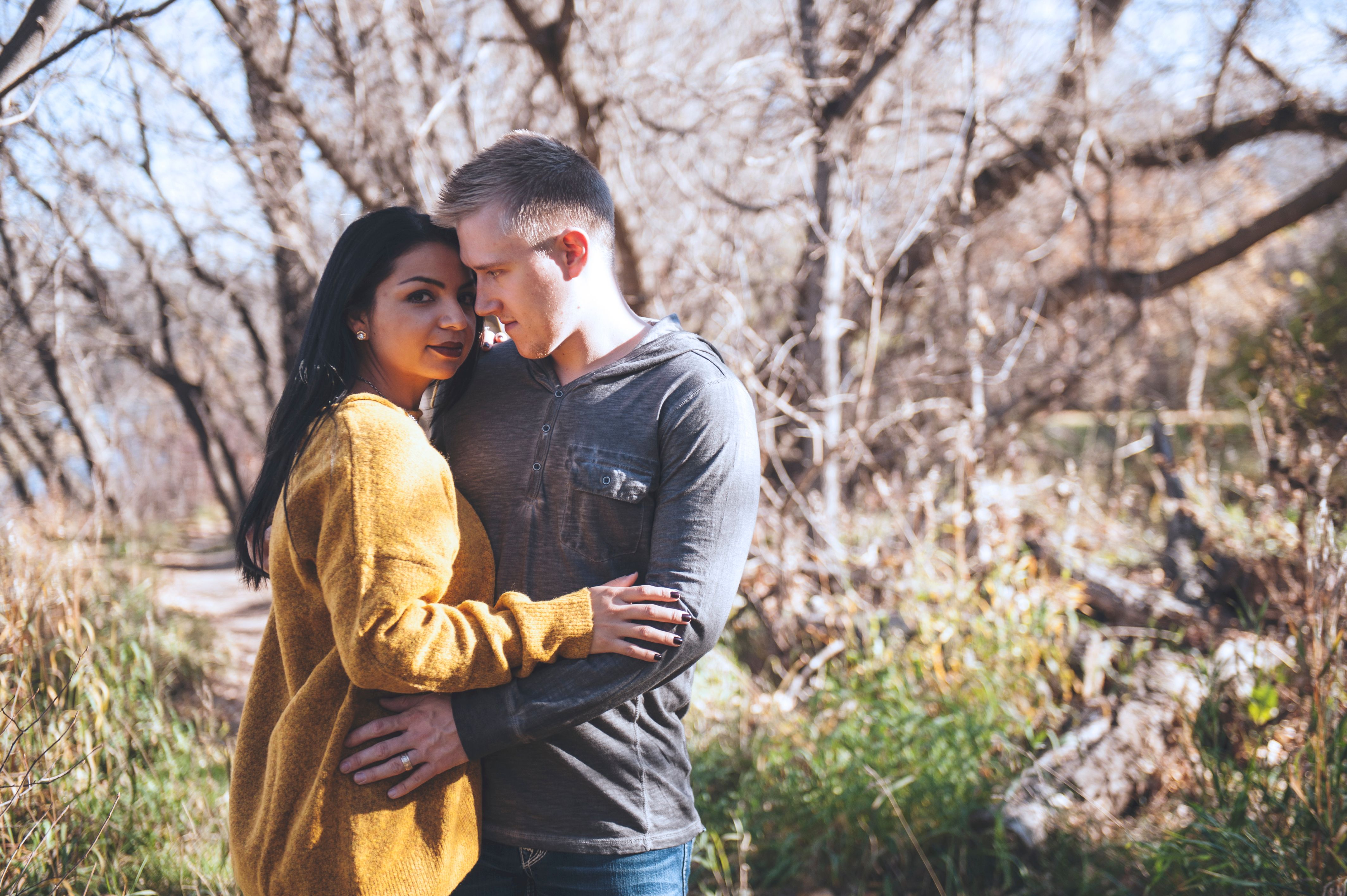 A Man Hugging a Woman from Behind · Free Stock Photo