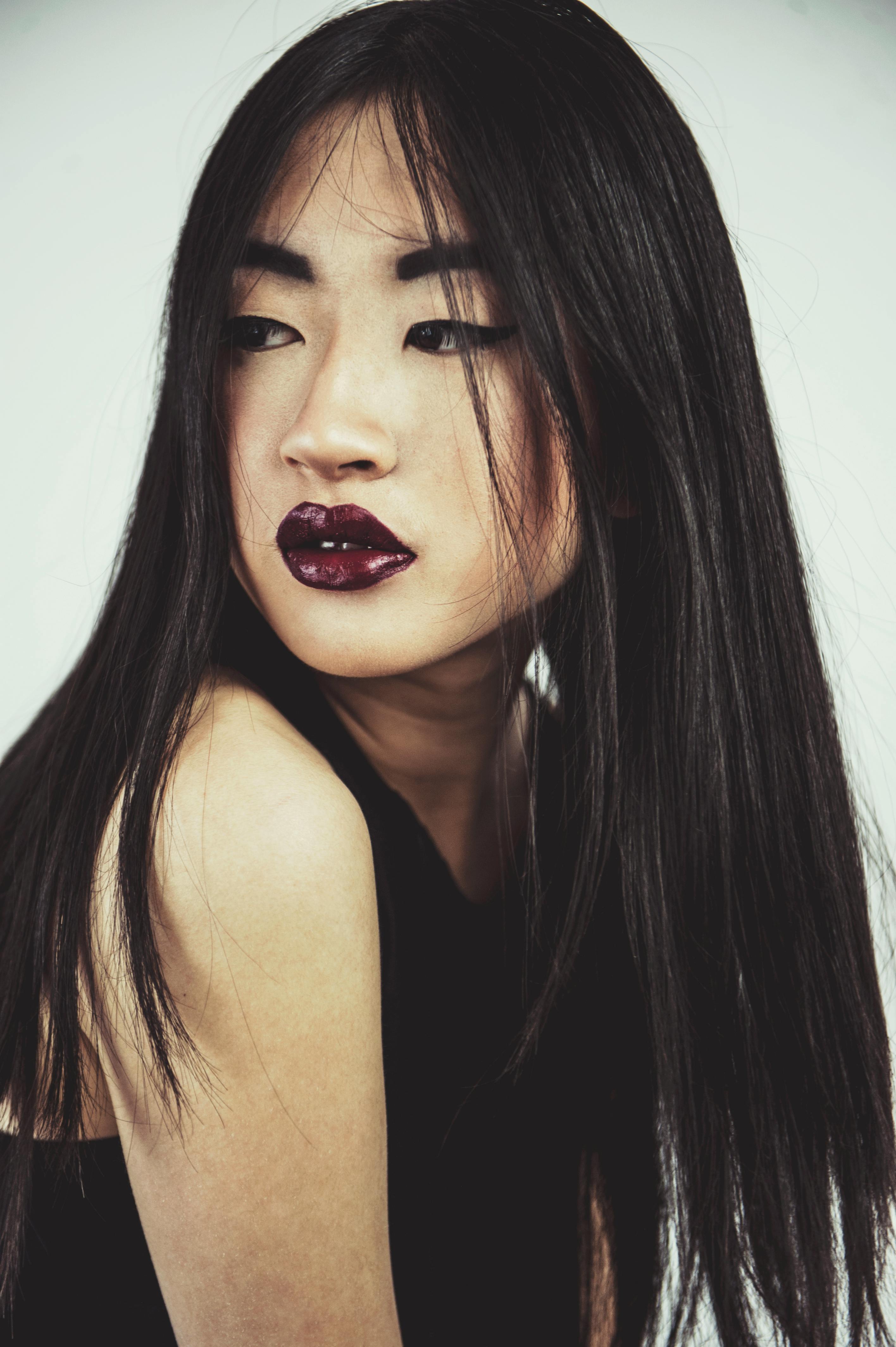 Photo of Woman in Dark Lipstick and a Black Sleeveless Top Posing ...