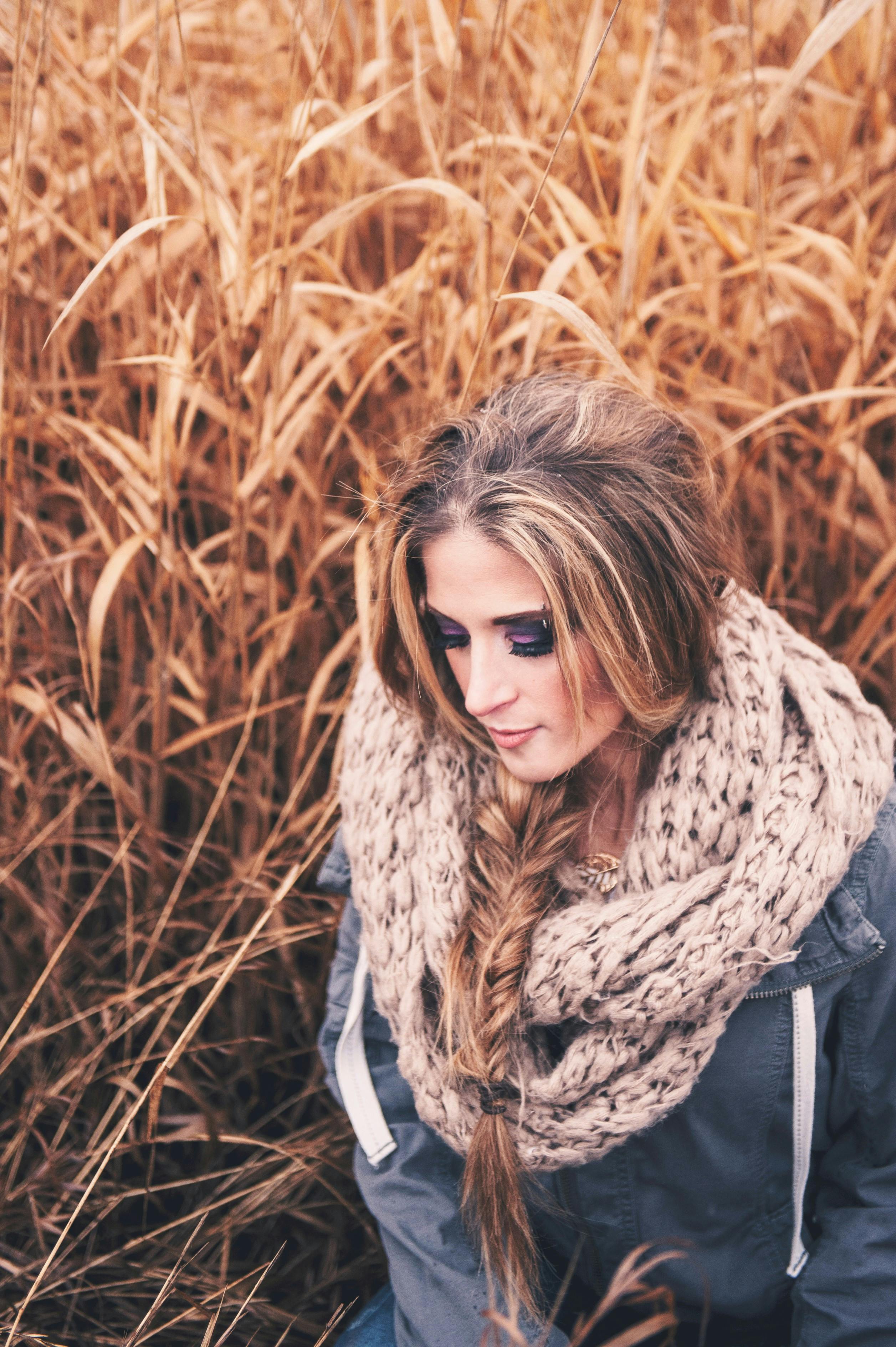 Selective Focus Photo of Woman in Blue Jacket and Knitted Scarf Posing ...