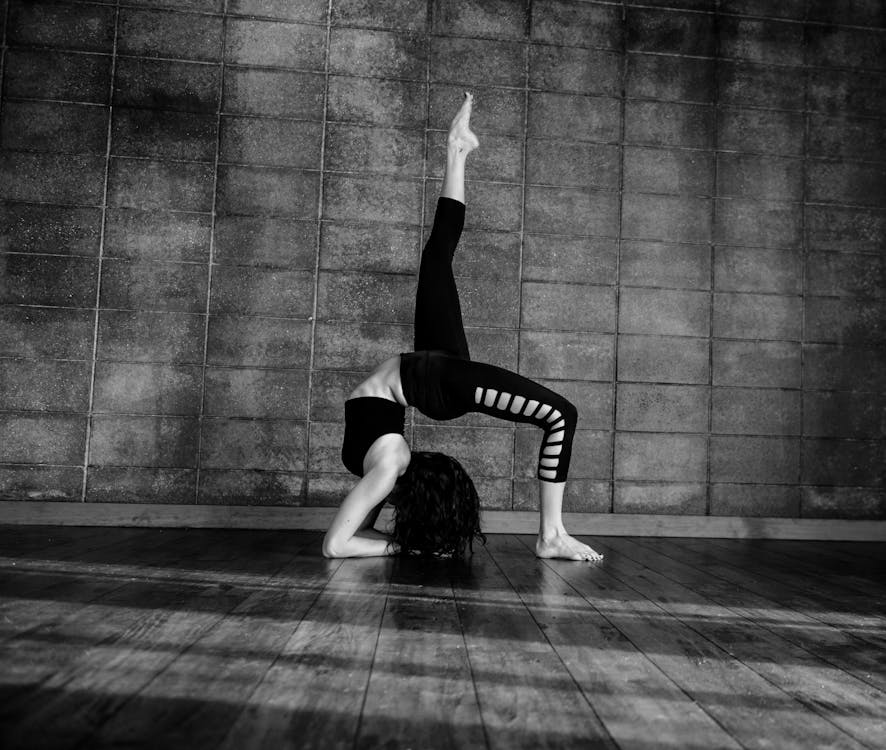 Grayscale Photo Of Woman Exercising