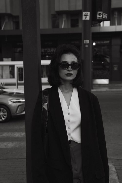 Free Stylish woman poses in black and white on Baku's urban streets, embodying modern fashion. Stock Photo