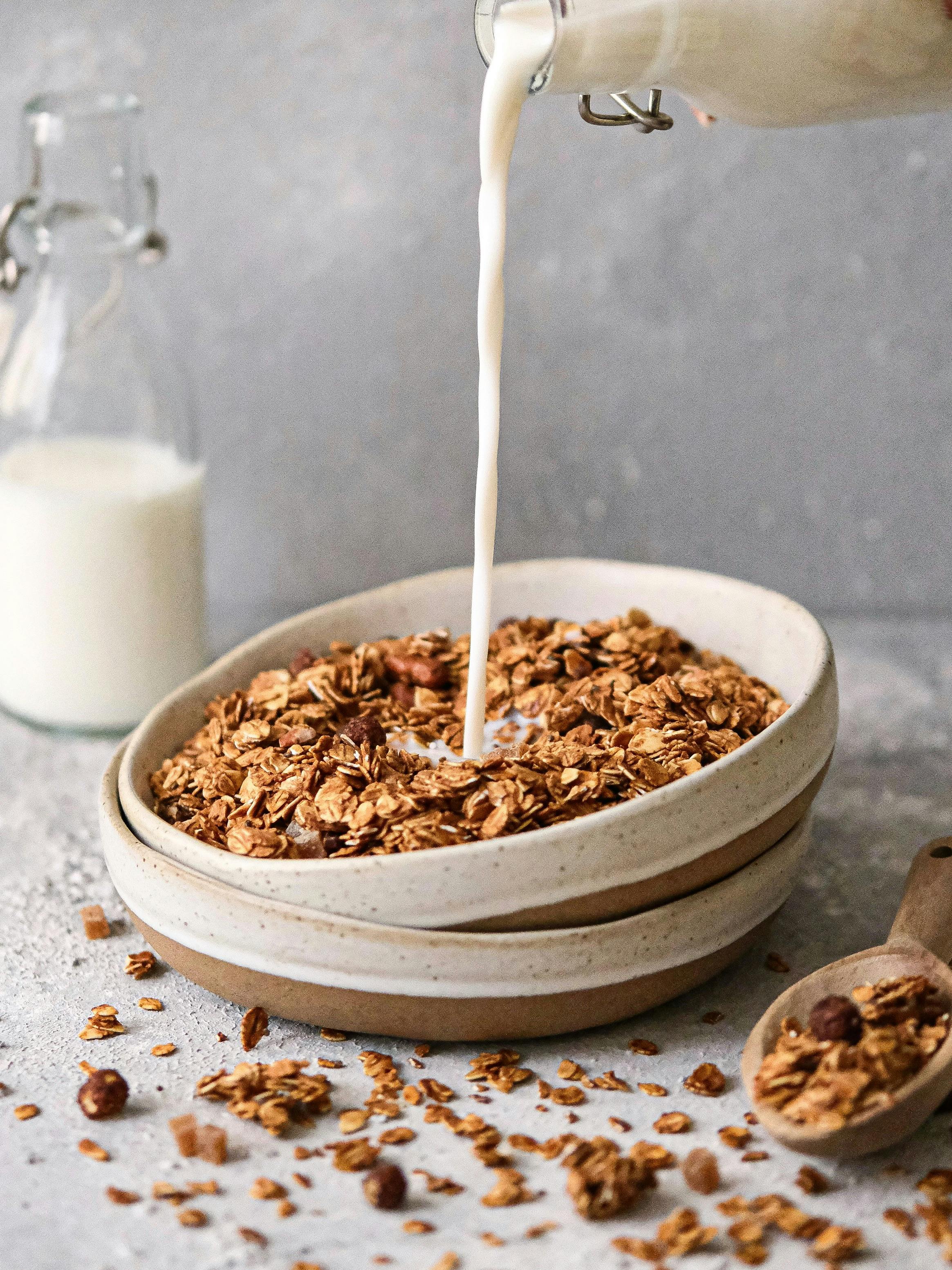 Close-up of milk pouring onto granola in İstanbul, Türkiye.