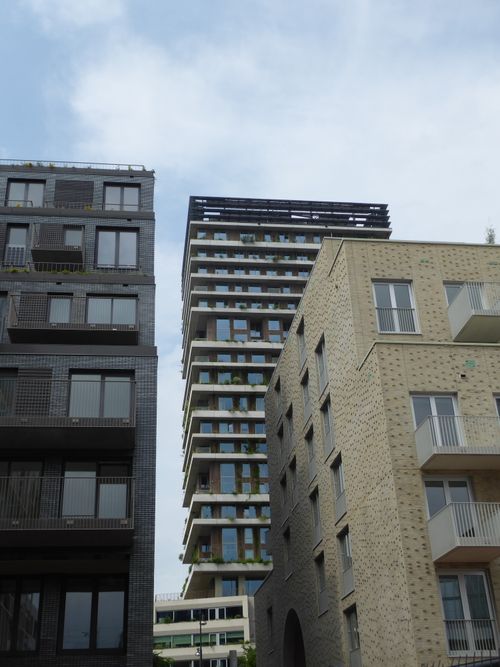 Free Low-angle view of contemporary apartment buildings in a bustling city. Stock Photo