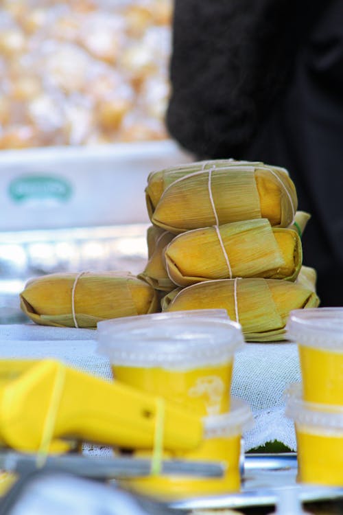 A stack of banana wrapped in plastic and yellow
