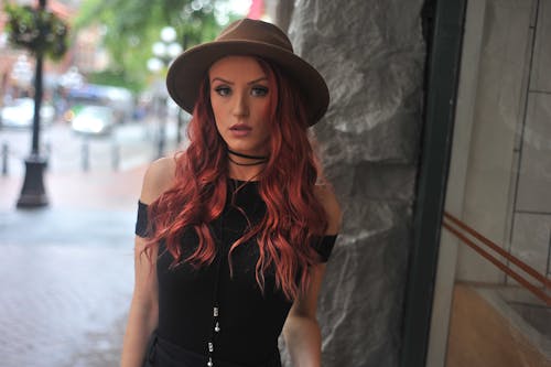 Photo of Woman Wearing Brown Fedora