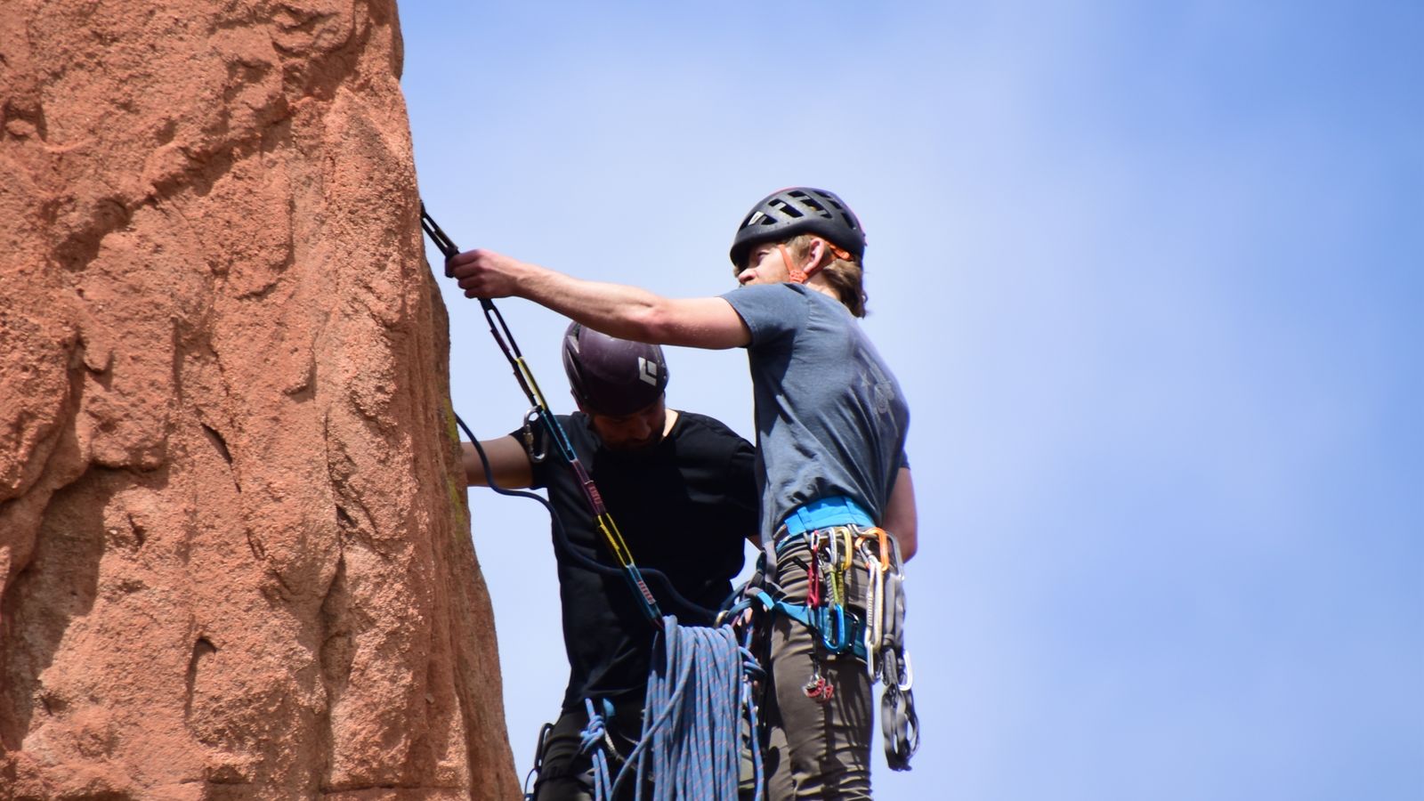 A climber on an outdoor rock face