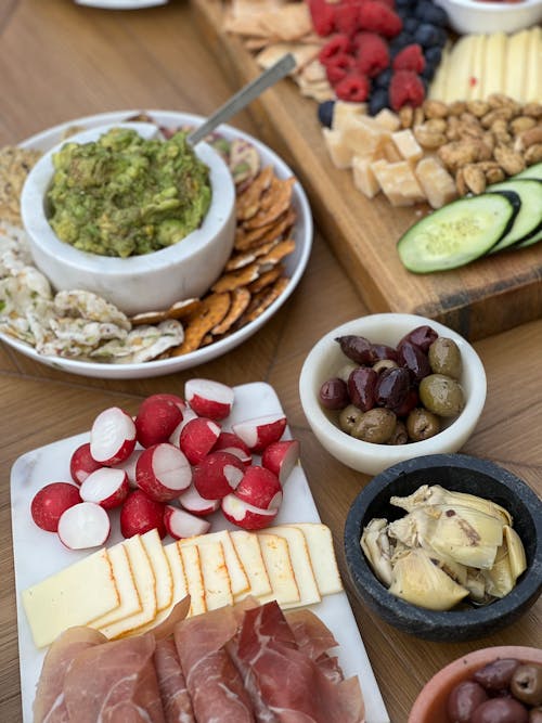 A variety of foods on a wooden cutting board