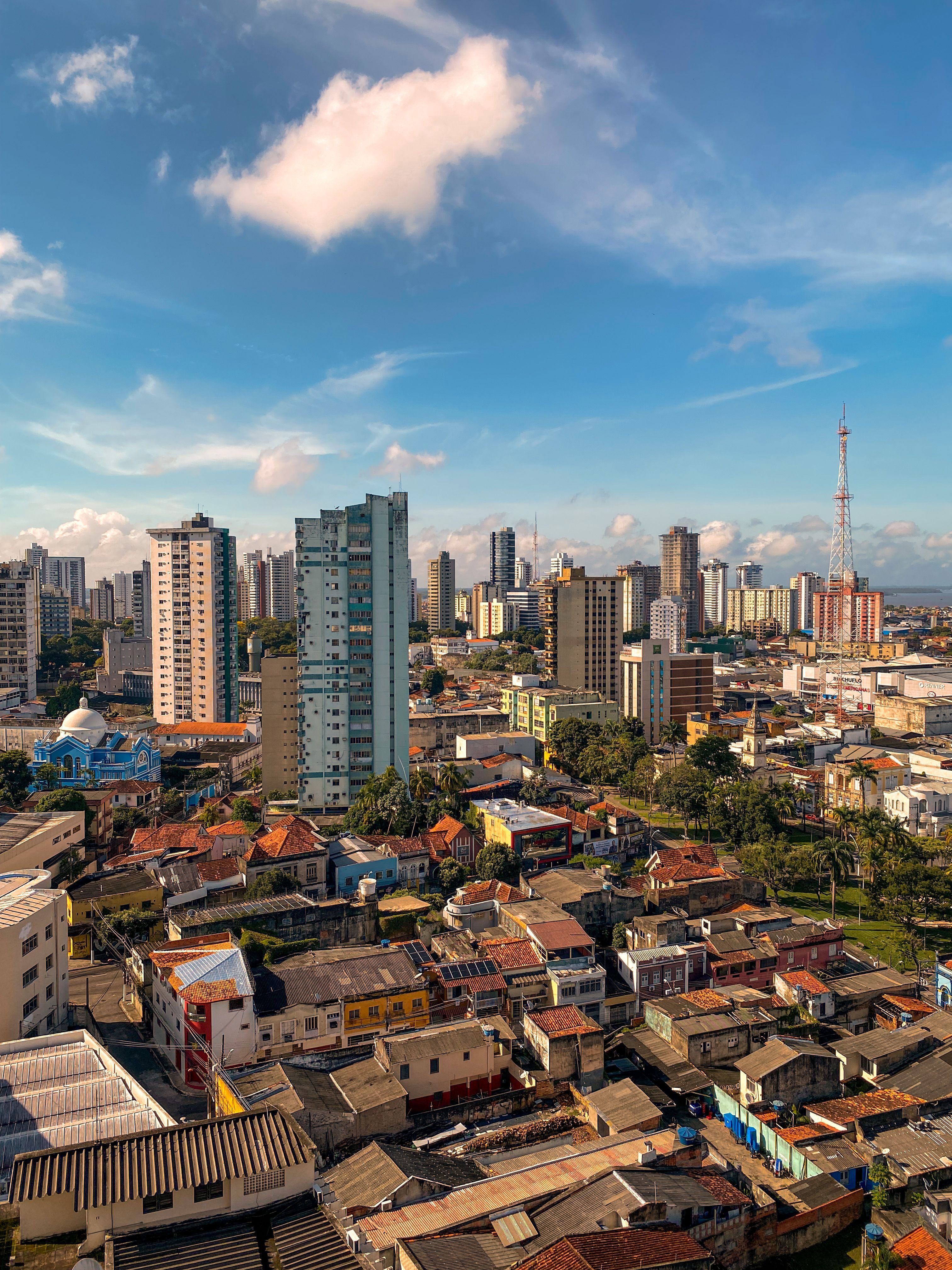 A city skyline with tall buildings and blue sky · Free Stock Photo