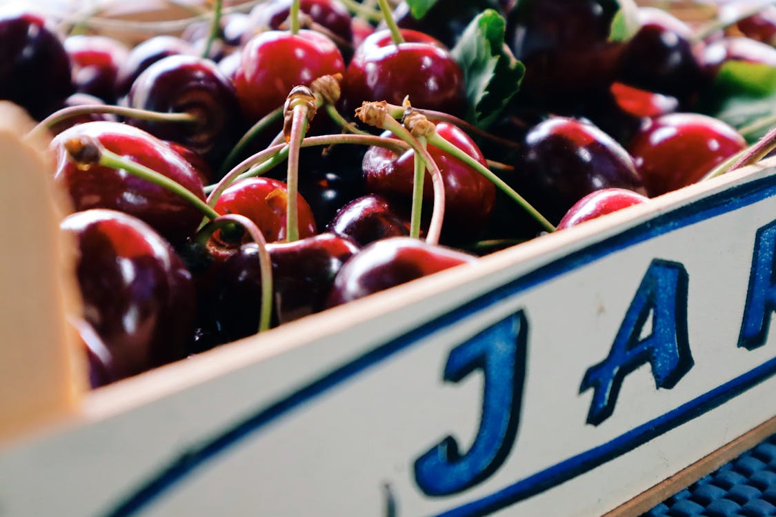 Free Close-up Photo of a Box of Red Cherries Stock Photo