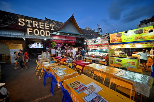 Bustling night market with colorful street food stalls in Patong, Phuket, showcasing vibrant Thai culture.