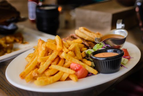 Free Fries on Plate Stock Photo