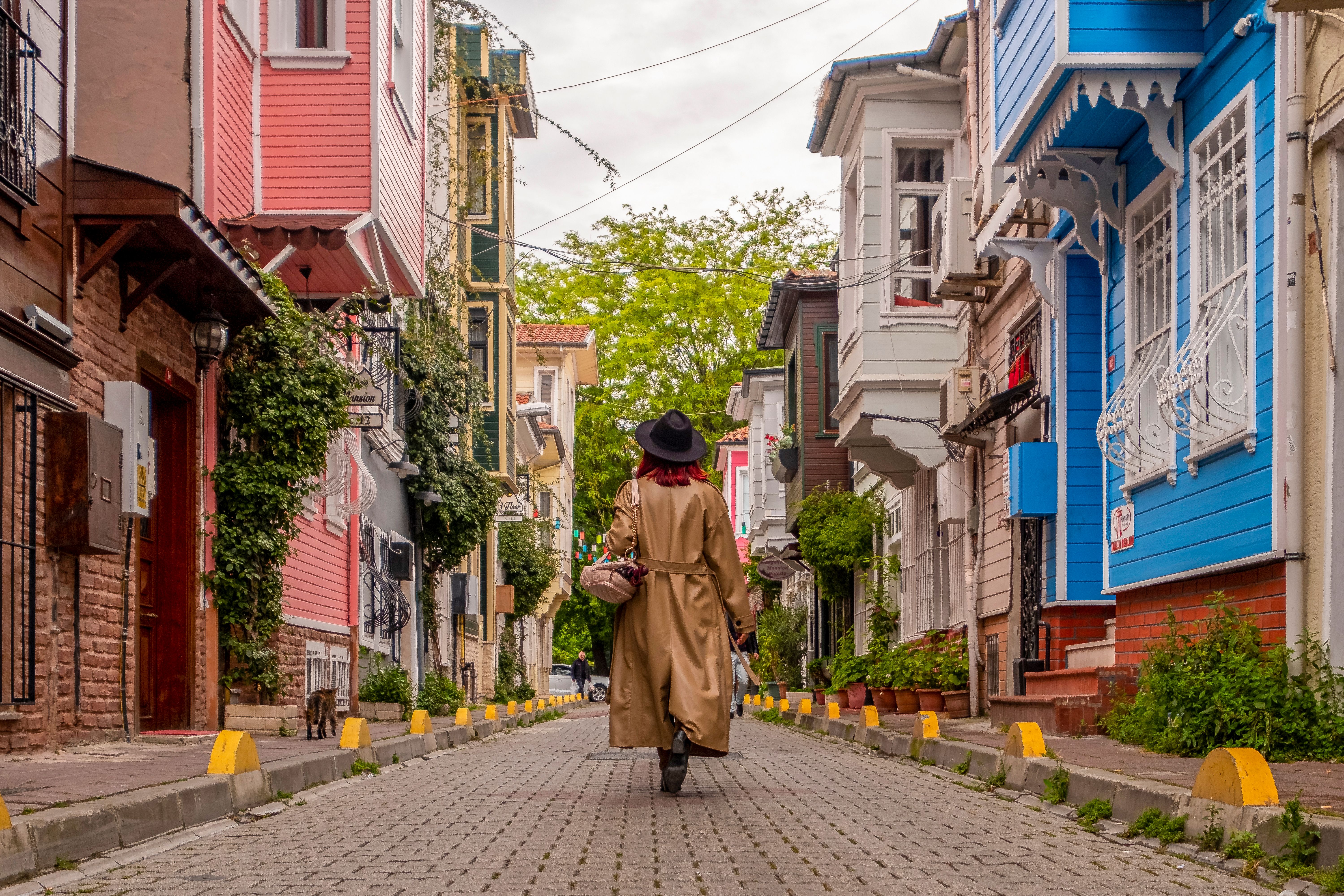Elegant Woman in a Trench Coat Walking down the Street in a City · Free ...