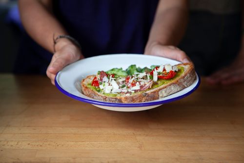 Free Close-up of avocado toast with tomatoes and cheese, perfect for healthy meals. Stock Photo