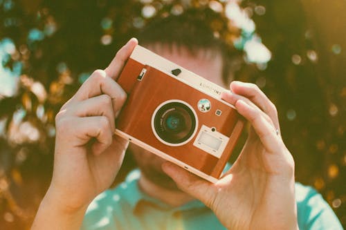 Man Holding Camera 