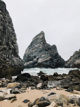 Majestic rock formations along the rugged coastline of Colares, Portugal.