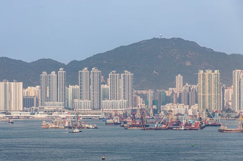 A large body of water with many boats and buildings