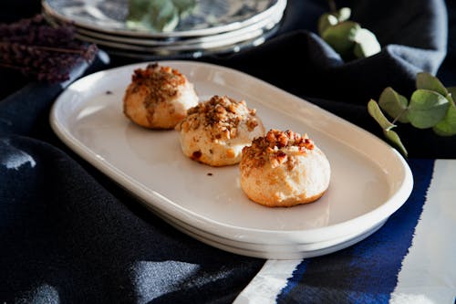 Three small balls of dough on a white plate