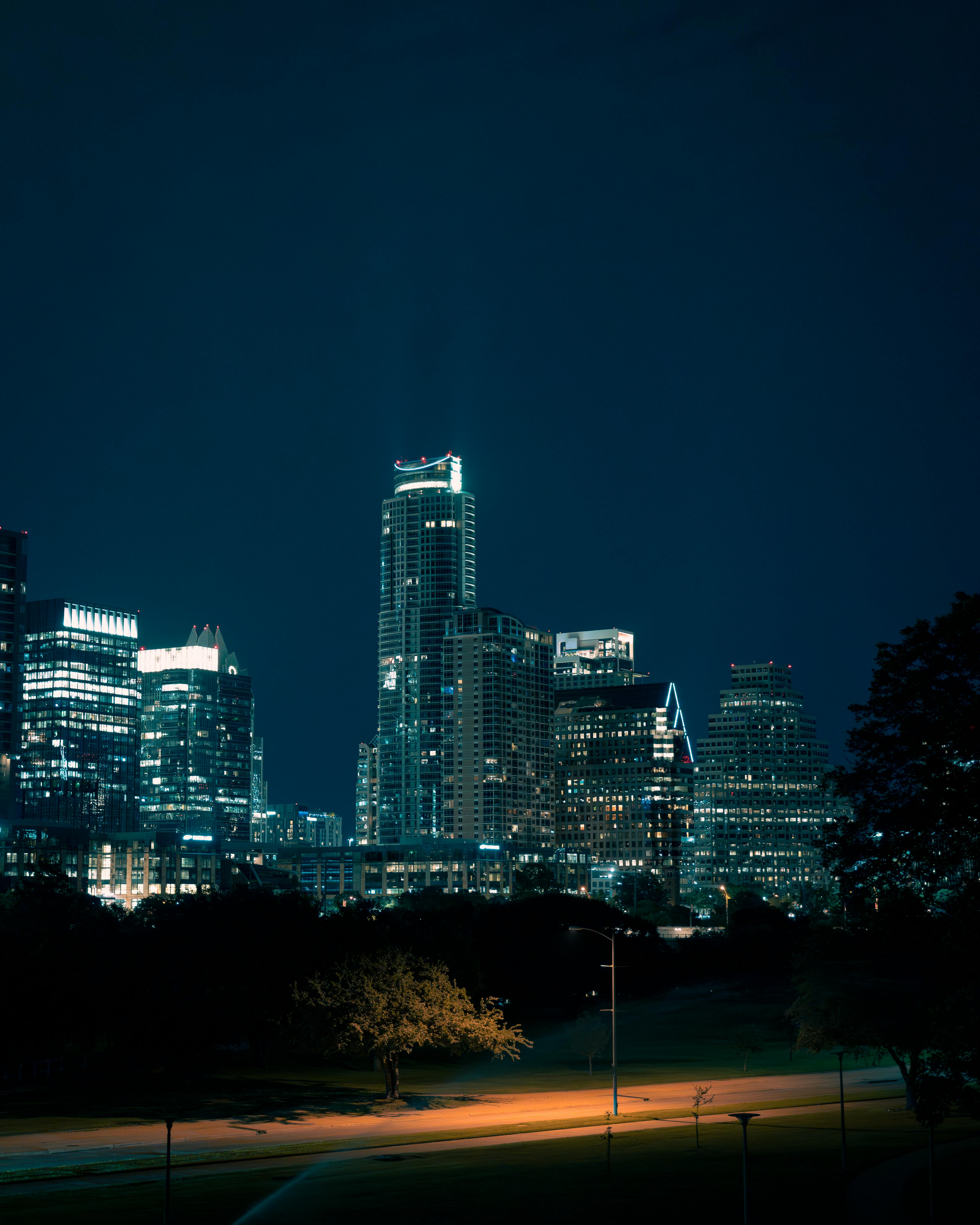 Illuminated Austin skyline showcasing vibrant skyscrapers against the night sky.