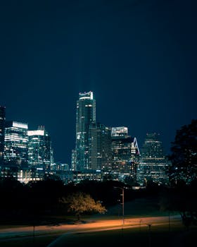 Illuminated Austin skyline showcasing vibrant skyscrapers against the night sky.