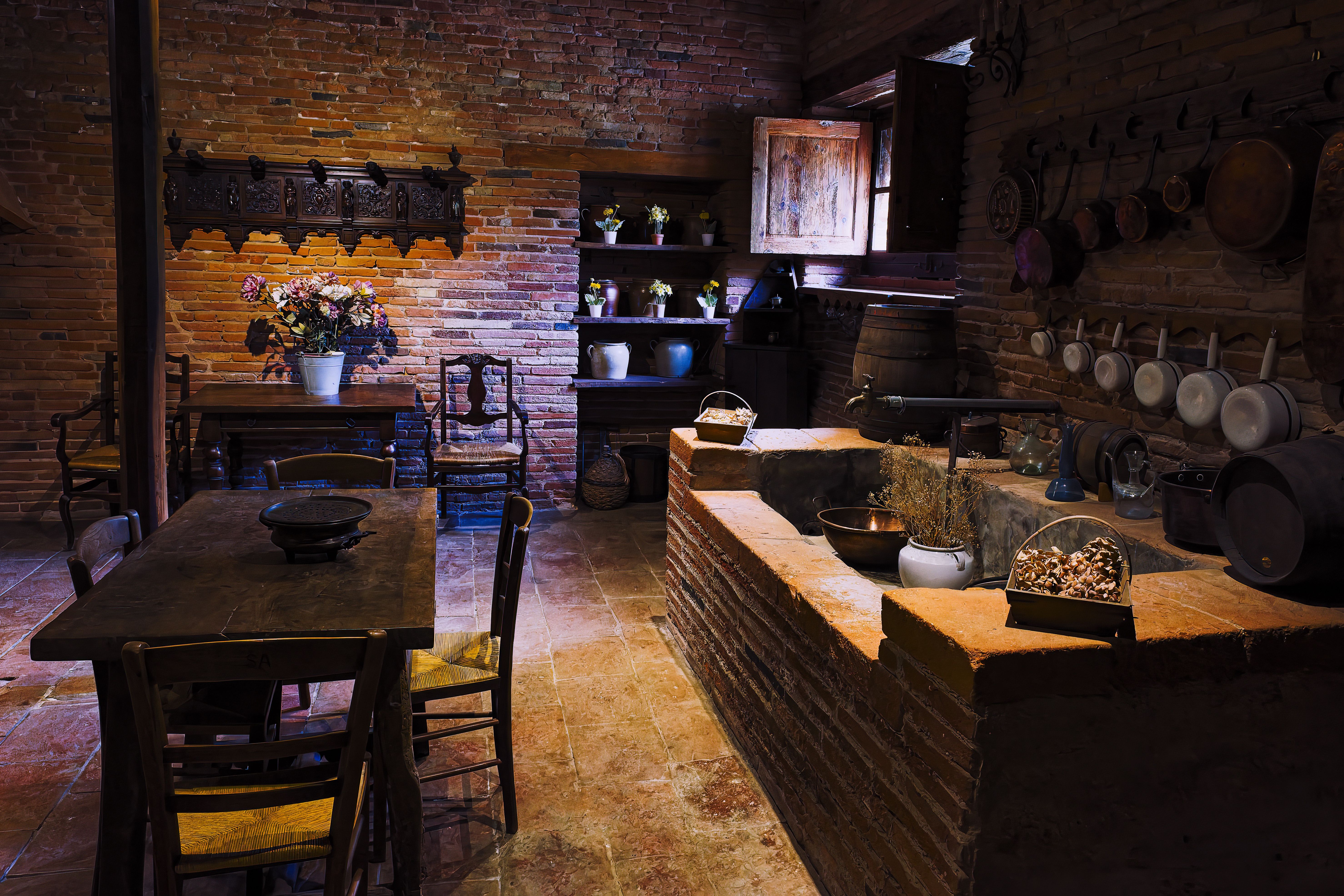 Long dining table in a restored stone farmhouse in the Segovia countryside
