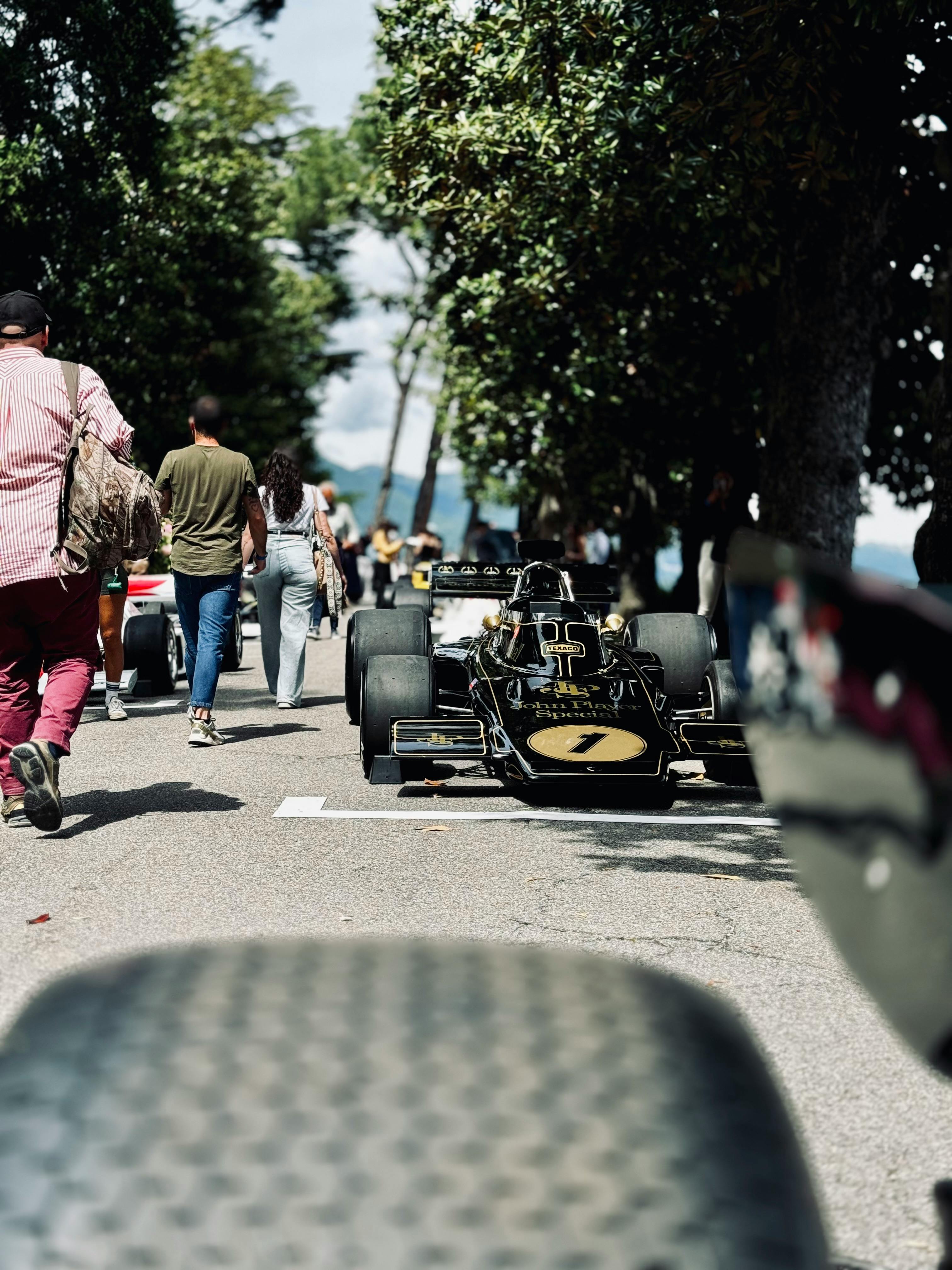 people walking between formula