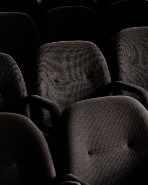 Free Rows of empty gray seats in a Chillán theater highlighting cinema ambiance. Stock Photo