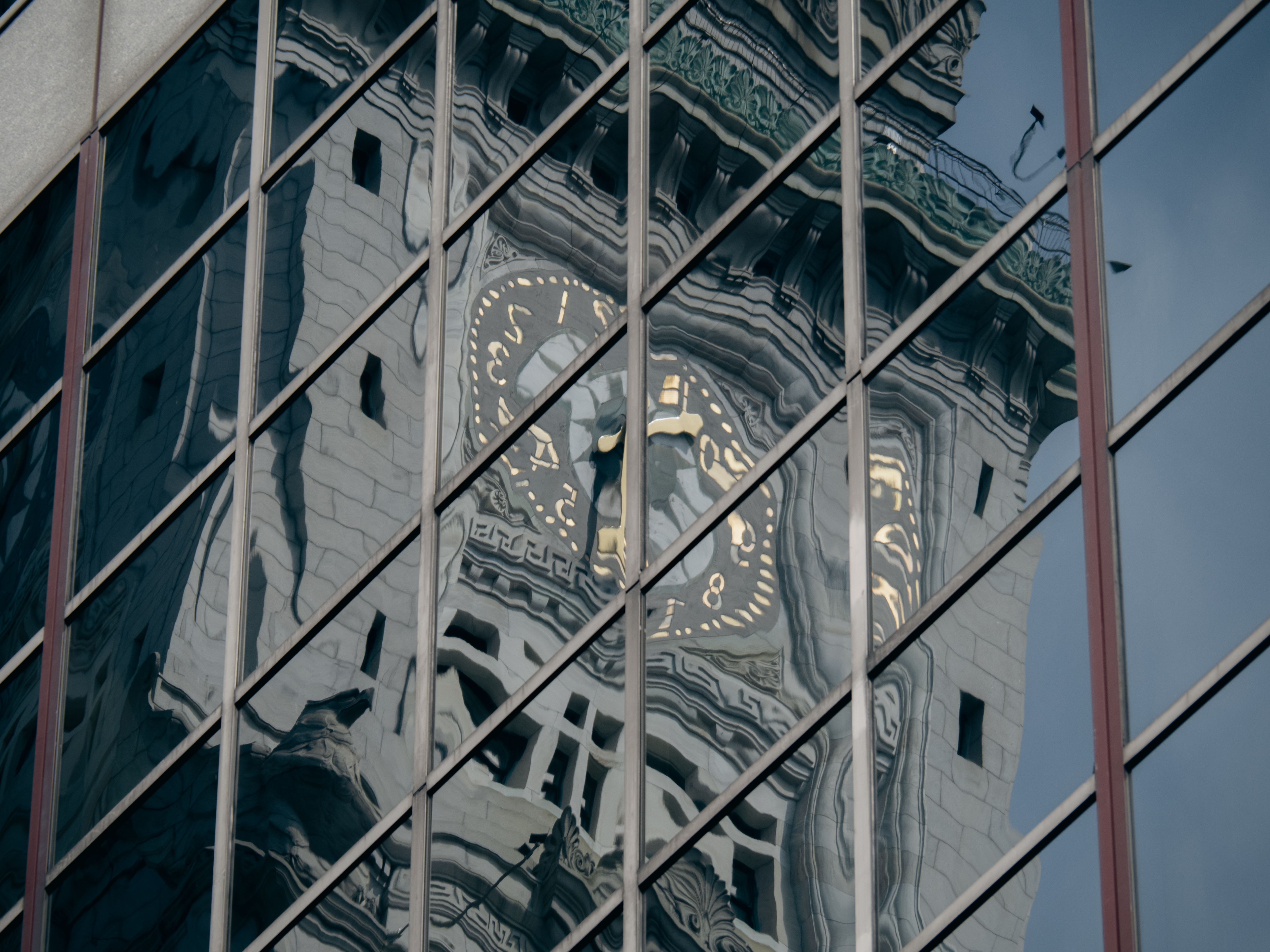 Clock tower on a tall building facade