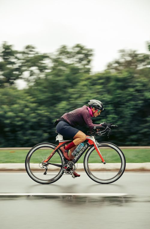 Free Adult cyclist in motion on a road bike, showcasing speed and athleticism outdoors. Stock Photo