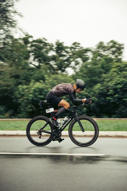 A cyclist in motion during a competitive outdoor biking event.