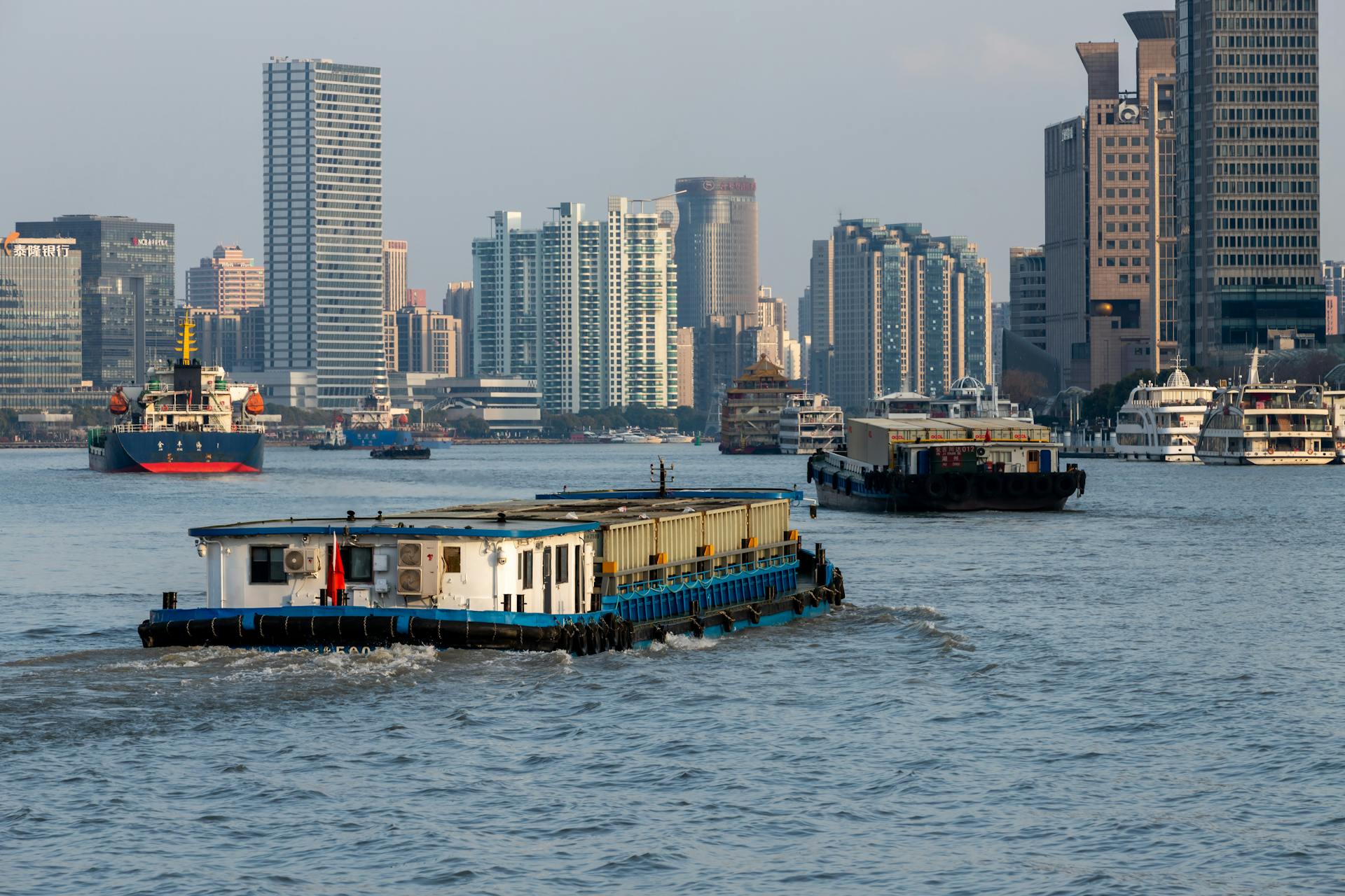 Barges on Huangpu River in Shanghai, China
