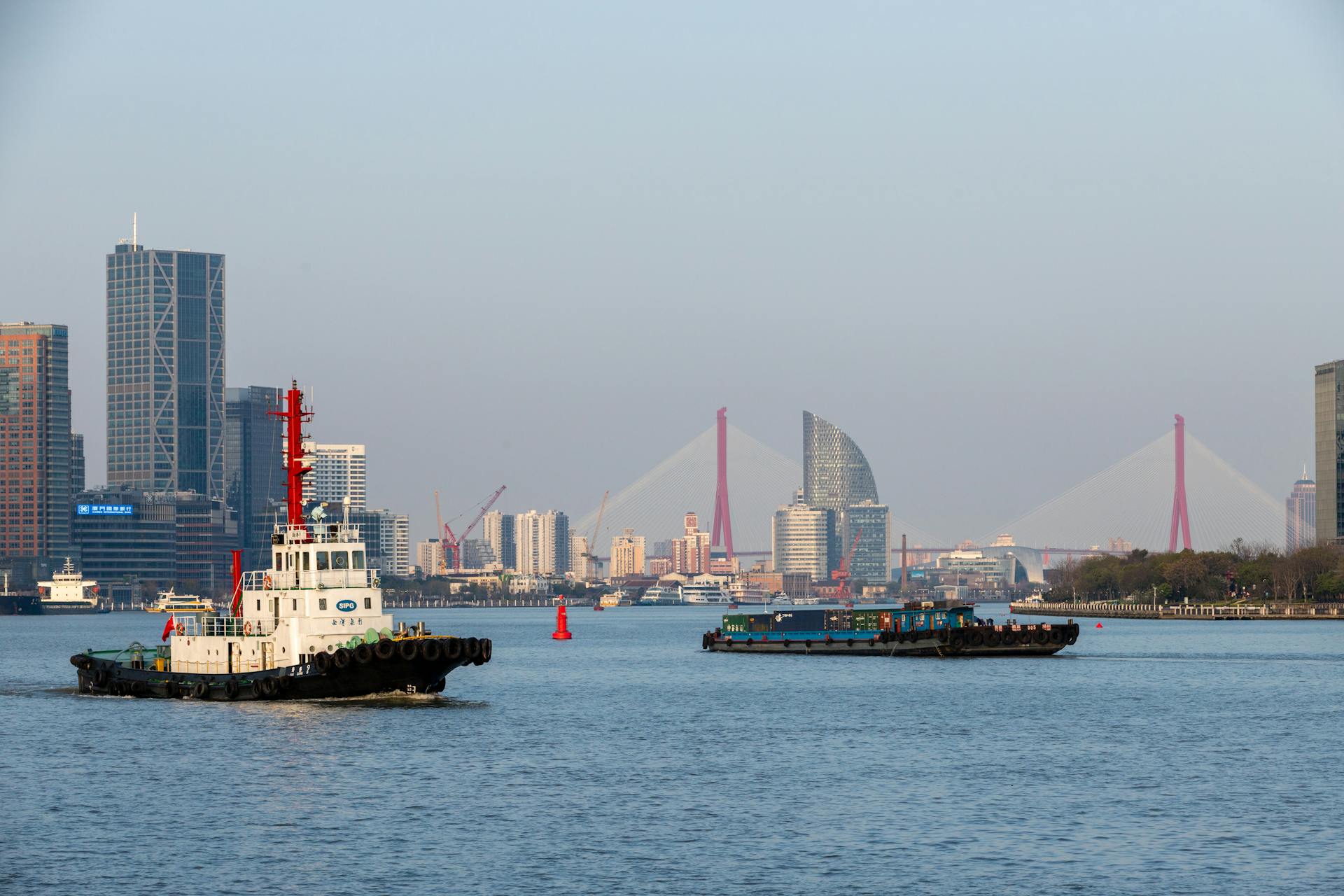 Tugboat and Cargo Barge on the River in Shanghai