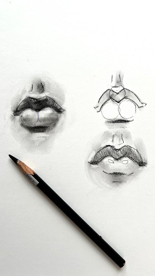 A pencil drawing of a woman's lips and a pencil