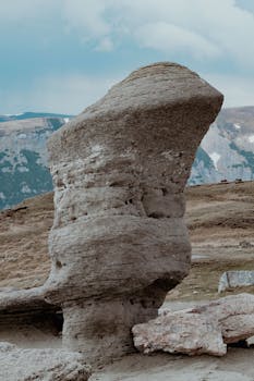 Explore the natural beauty of eroded rock formations in Bușteni, Romania's picturesque mountains.