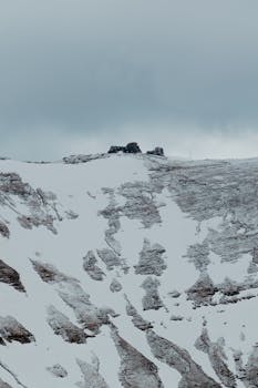 Breathtaking snowy mountain view captured in Bușteni, Romania during winter.