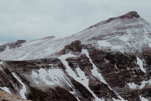 Free Winter view of snow-covered Carpathian Mountains in Bușteni, Romania, showcasing rugged terrain. Stock Photo