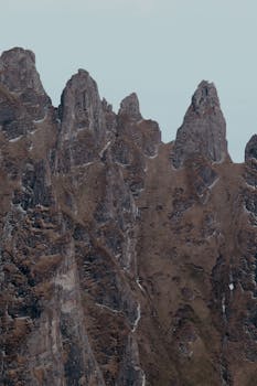 Majestic peaks of Bucegi Mountains, Romania, showcasing rugged rock formations.