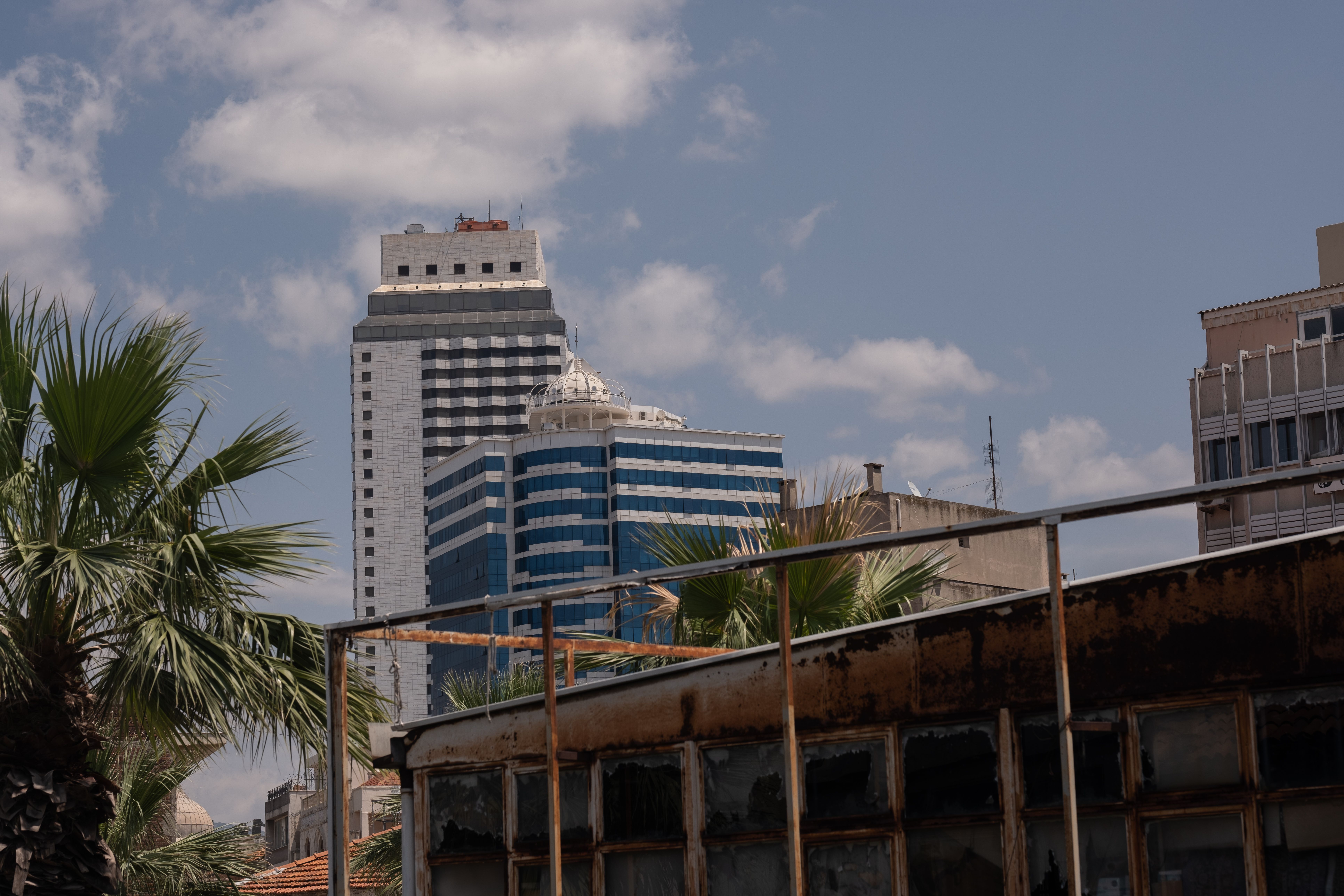 Buildings behind Wall and Bar · Free Stock Photo