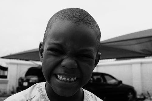 Black and White Photo of Boy Smiling