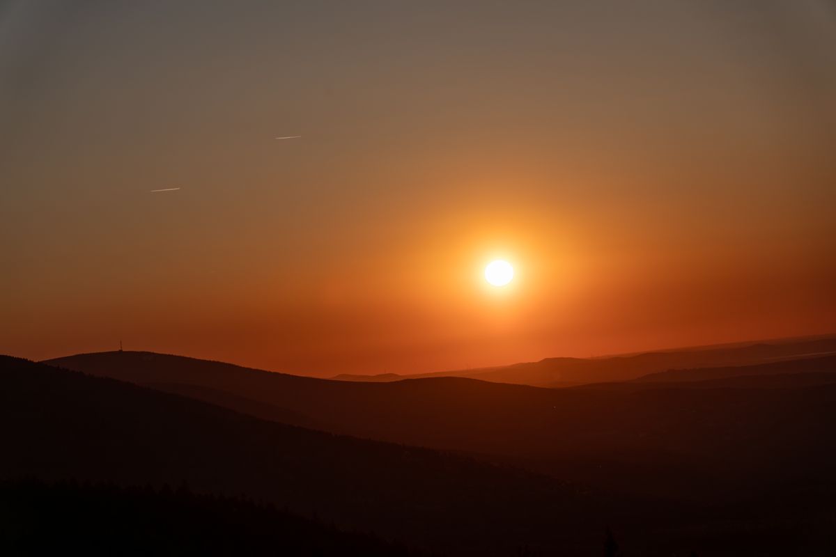 Stunning Sunset Over Rolling Hills · Free Stock Photo