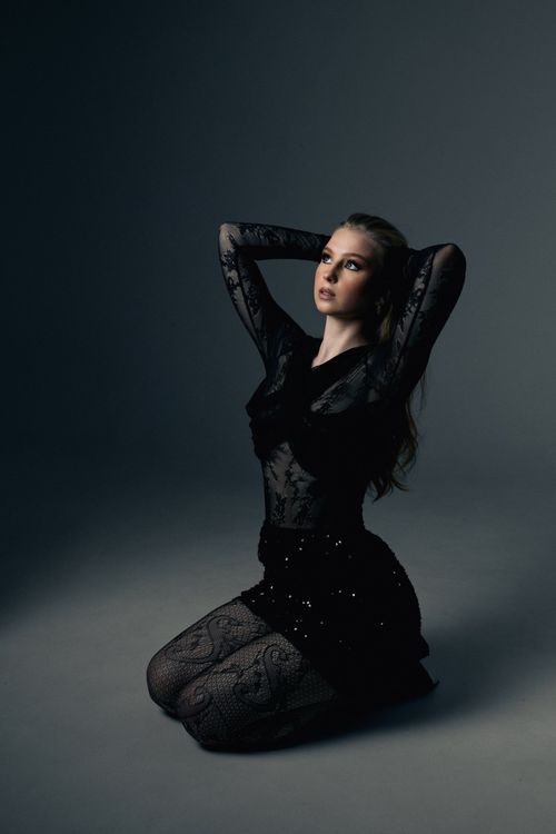 Woman Posing in Black Clothes in a Studio · Free Stock Photo